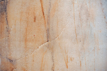 Warm natural marble texture with scratches. Backdrop to use for design or art work.