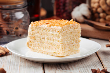 Sweet dessert slice of honey cake on a plate