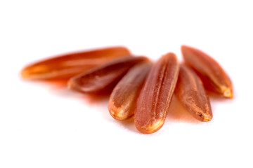Macro shot of red rice isolated on white background, food