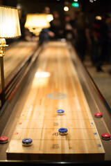 Playing the game of shuffleboard.