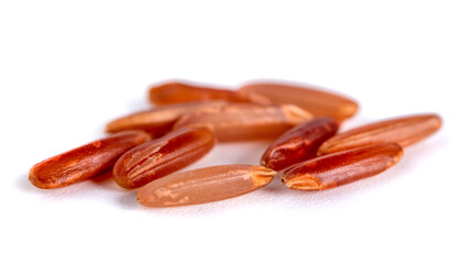 Macro shot of red rice isolated on white background, food