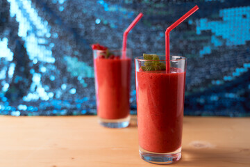 Strawberry and banana smoothies with long glass glasses on tablecloths