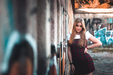 Fototapeta premium Young girl posing in old ruins.