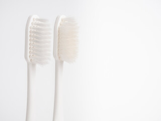 Comparison Concepts. Old used and new pastel toothbrush comparison on white background .