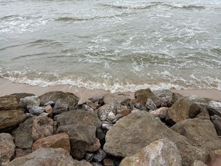 Rock on the beach with beautiful clouds tropical sea at South of Thailand