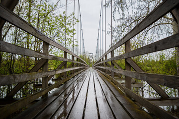 Obraz premium Wooden bridge over the river.