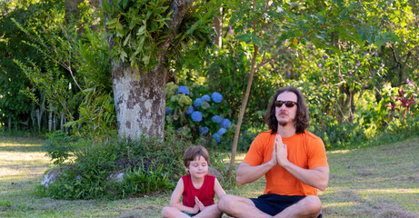Uncle and nephew meditating and playing in nature.