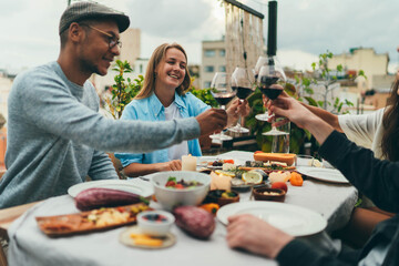 Group of Diversity People having Dinner Party at home terrace with cozy garden, Best friends having...