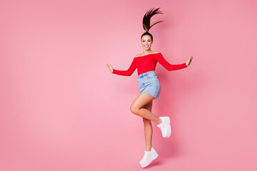 Full length body size view of her she nice-looking attractive lovely slim fit slender cheerful cheery carefree girl jumping having fun free time weekend isolated over pink pastel color background