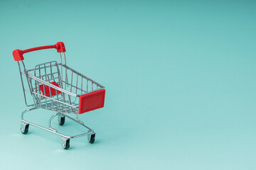 selective focus, small toy grocery cart