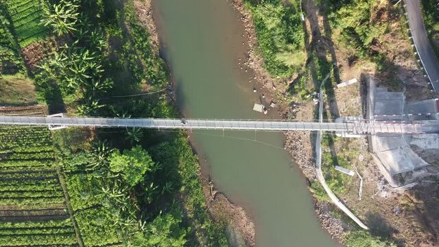 aerial view of the Pengkol suspension bridge in Imogiri Bantul, the bridge across the Oyo river