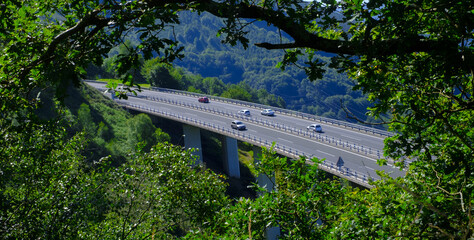 Fototapeta premium Cars and traffic on the A15 motorway near the municipality of Berastegi, Euskadi