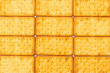 Cracker with salt isolated on white.