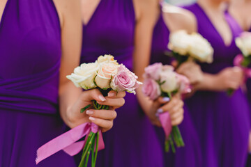 
bridesmaids hold flowers