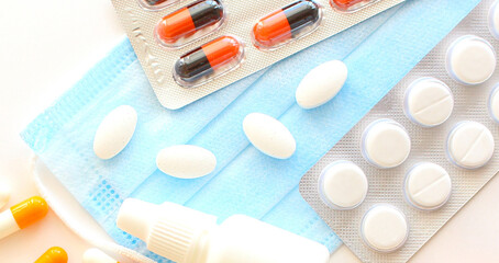 packaging for drugs: painkillers, antibiotics, vitamins and aspirin tablets. Set of white blisters with pills and capsules.