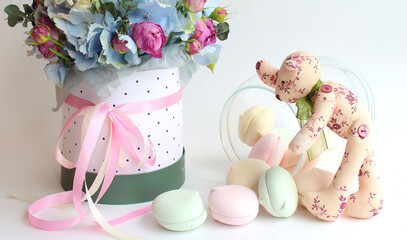 bouquet of flowers, jar with marshmallows, handmade teddy bear