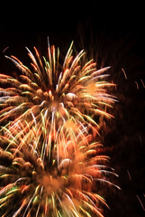 Sparkling fireworks display against the night sky. abstract background for celebration merry christmas, birthdays, Victory Day, independence, holidays, celebration, party, festival, new year concept