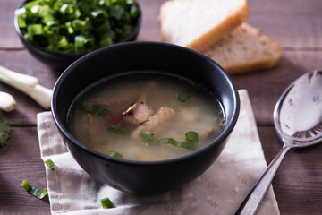 Fresh fish soup with ingredients and spices for cooking. Woodn background
