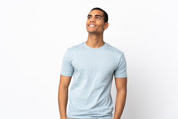 African American man over isolated white background thinking an idea while looking up