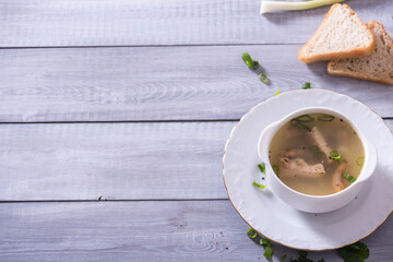 Fresh fish soup with ingredients and spices for cooking. Woodn background