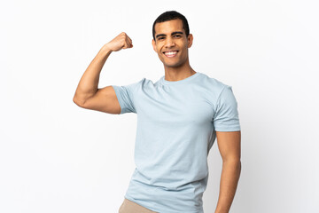 African American man over isolated white background doing strong gesture