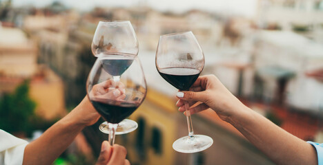 Group of people toasting at rooftop bar, Friends enjoying drinks at rooftop party, Celebration Summer Hang Out Friendship Concept