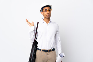 African American architect man with helmet and holding blueprints over isolated white background _ having doubts while raising hands