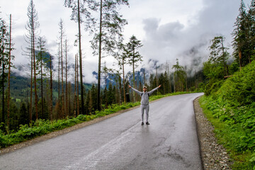 A man travels to the mountains. Hiking. High mountains in summer on a rainy day. Тatras.