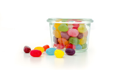 Colorful candies in a glass jar.