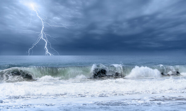 Stormy sea and a lightning in the background