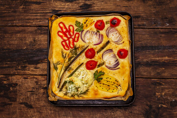 Colorful Garden Focaccia. Fresh ripe vegetables, olive oil, greens. Traditional Italian bakery