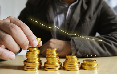 Businessman putting money coins. Business Growth concept.