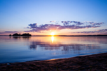 Naklejka premium Magical fairytale sunset in the evening on the lake