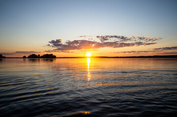 Magical fairytale sunset in the evening on the lake