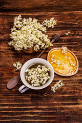 Obraz na płótnie Canvas Tea from fresh elder flowers. Hot drink, honey, alternative medicine