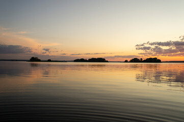 Fototapeta premium Magical fairytale sunset in the evening on the lake