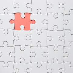 Fototapeta premium Set of white puzzle pieces and last one piece