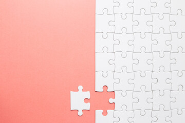 Set of white puzzle pieces and last one piece