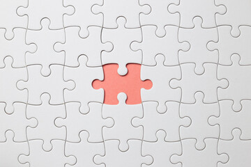 Set of white puzzle pieces and last one piece