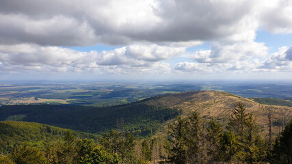 view of an unwooded mountain top and low-hanging clouds 