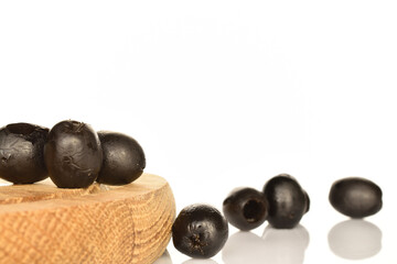Pickled spicy black olives, close-up, on a white background.