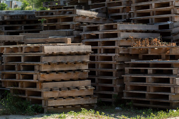 many old pallets are in a heap