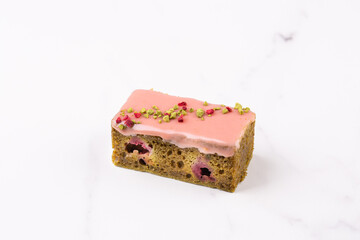 Match raspberry cake, delicate biscuit with added match tea and raspberry berries