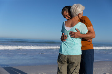 Fototapeta na wymiar Senior Caucasian couple enjoying time at the beach