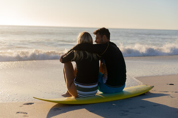 Caucasian couple enjoying time at the beach