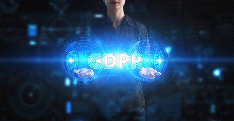 Business, Technology, Internet and network concept. Young businessman working on a virtual screen of the future and sees the inscription: GDPR
