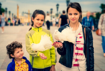 Moscow, Russia. June 30, 2015: white pedigree pigeons sitting on the hands of children walking around Moscow