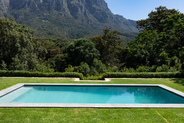 Magnificent view of a swimming pool standing in a garden