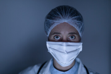 Healthcare worker wearing protective suit and face mask during coronavirus Covid19 pandemic