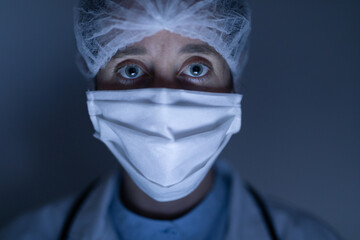 Healthcare worker wearing protective suit and face mask during coronavirus Covid19 pandemic